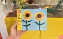 Hand-Holding-a-LEGO-Sunflowers-Building-Kit.webp