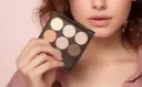 A-Woman-Holding-Myster-Rosey-Neutral-Eyeshadow-Palette.webp