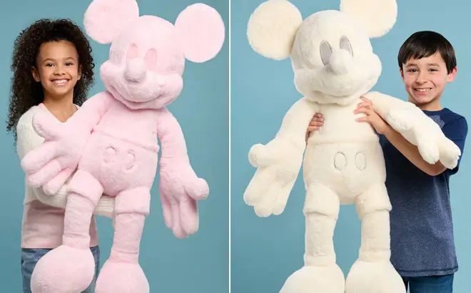 A-Girl-and-a-Boy-Holding-Disney-Mickey-Mouse-Monochromatic-Jumbo-Plush-Dolls.webp