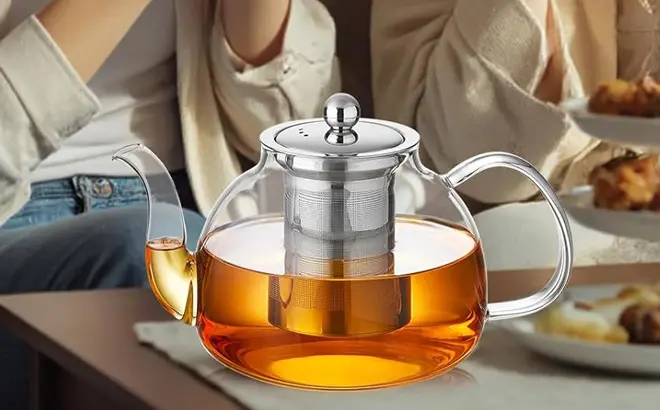 Glass-Teapot-with-Infuser-at-Table.webp