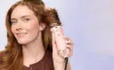 A-Person-Using-the-Wavytalk-Ionic-Hair-Dryer-Brush.webp