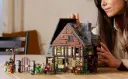 LEGO-Ideas-Hocus-Pocus-The-Sanderson-Sisters-Cottage-on-a-Table.webp
